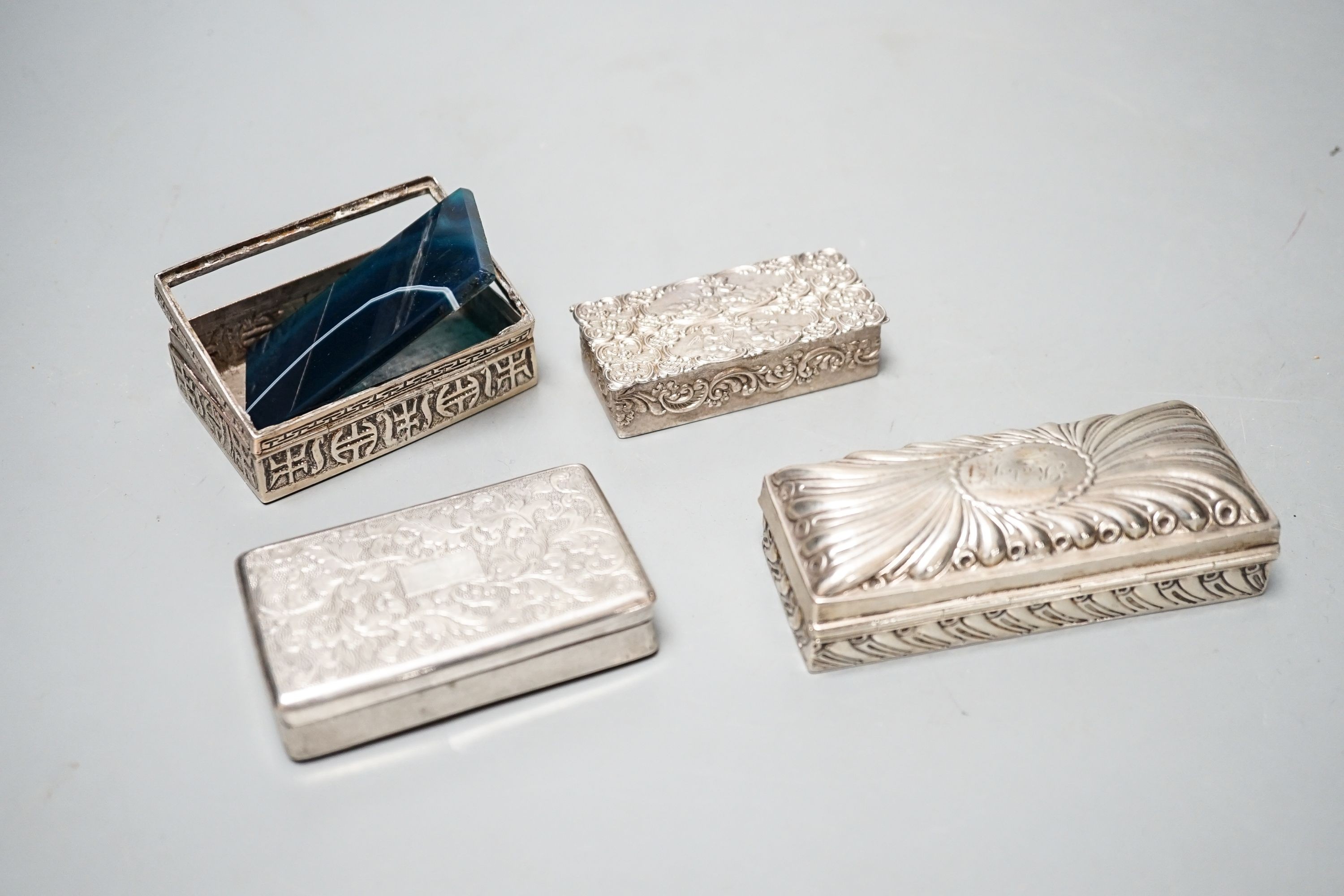 A late Victorian silver ring box, London, 1895(a.f.), 97mm, a later silver snuff box and two white metakl boxes.